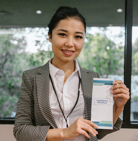 Woman holding an envelope.